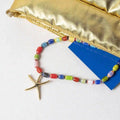 collier aster perles verre multicolores pendentif etoile de mer dore bijou femme